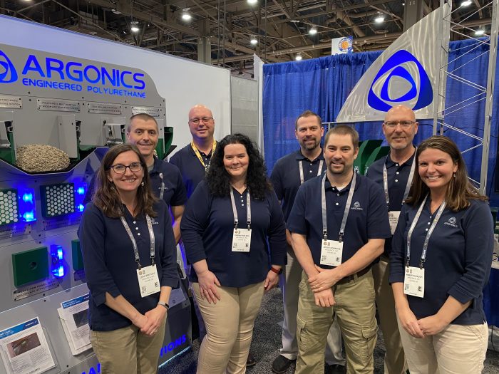 Argonics staff at trade show booth in Las Vegas